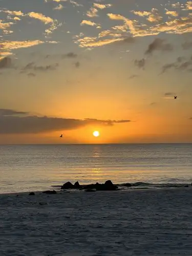 Golden hour glow over the tranquil ocean.